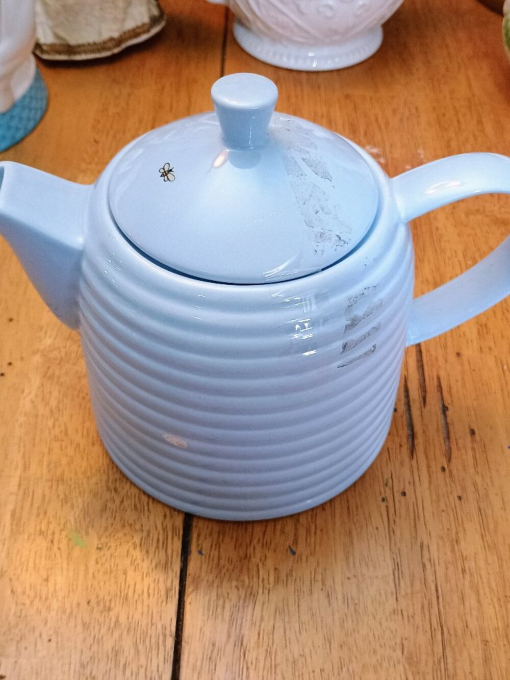 Vintage blue honeycomb teapot with cute bee on lid. "America Untold"